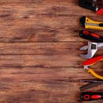 construction-tools-with-copy-space-on-a-wood-background_222342-84